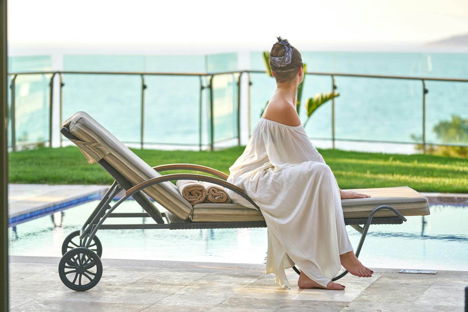 Woman Sitting On Lounge Chair